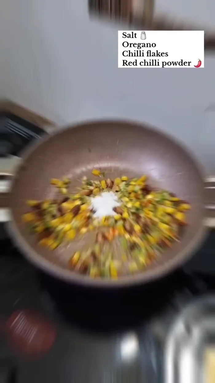 Add salt, oregano, chili flakes, and red chili powder to taste. Mix well.