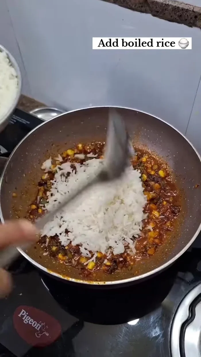 Add boiled rice and mix well.