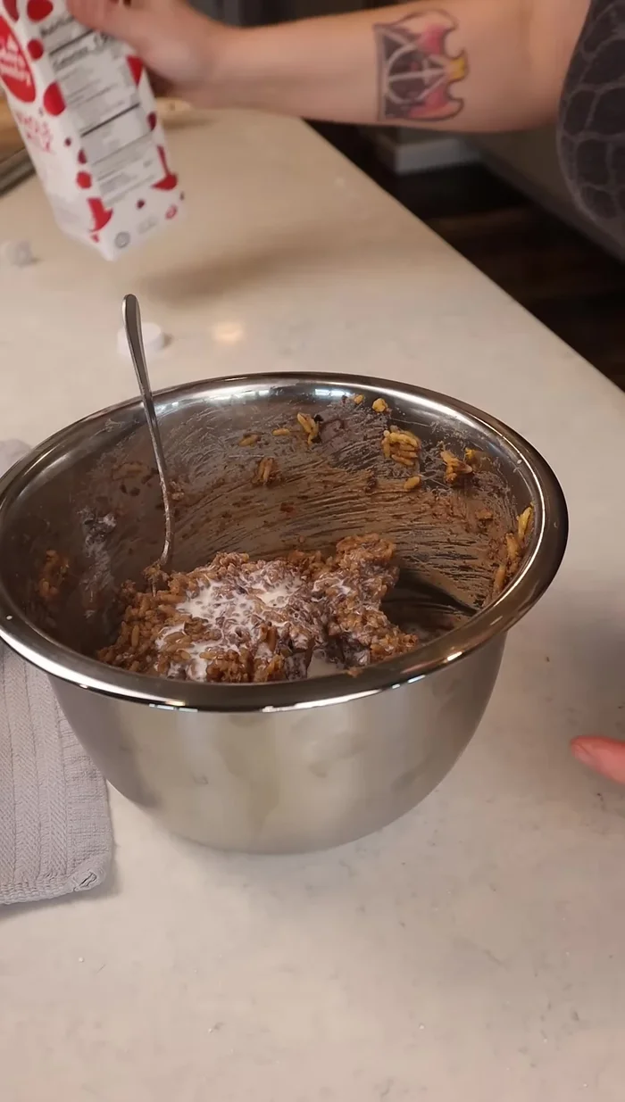 Mix the warmed rice and beans in a large bowl. Add a splash of milk for creaminess.