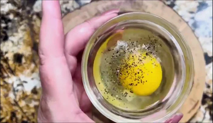 Cook the eggs: Heat oil in a pan, add sliced purple onion, then add eggs. Season with salt and pepper. Cook until desired doneness.