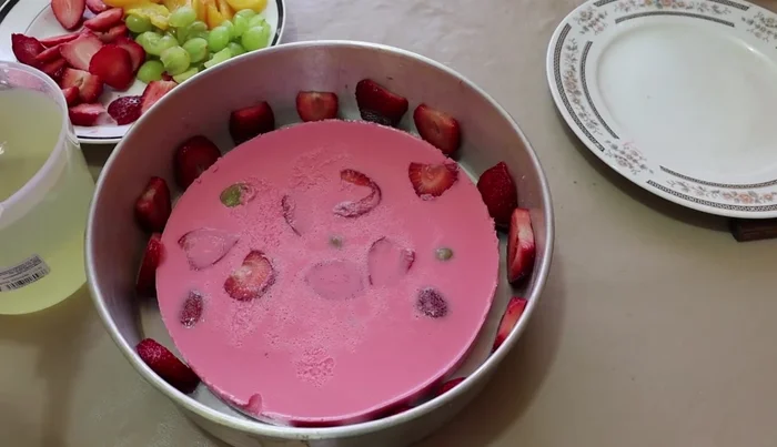 Pour another layer of clear gelatin over the fruit. Refrigerate until semi-set.