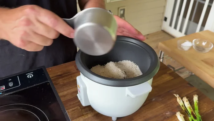 Cook the rice: Transfer the rice base to a rice cooker, add water and chicken base, and cook according to the manufacturer's instructions.