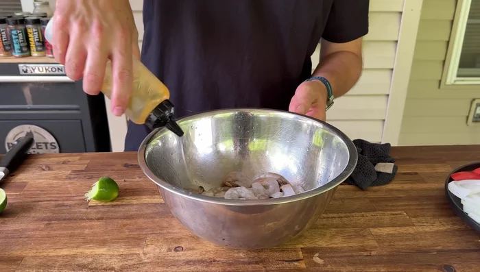Prep the shrimp: Marinate shrimp with lime juice, olive oil, and jalapeno buttermilk spice.