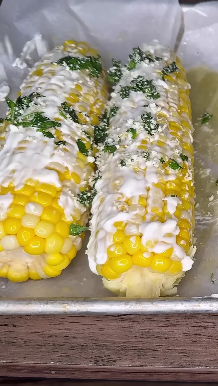 Sprinkle cotija cheese and cilantro over the corn.