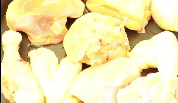 Season the chicken with salt and pepper. Fry for a few minutes over medium heat, covered.