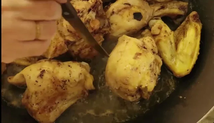 Once cooked, chop the chicken.