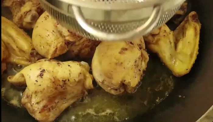 Strain the chili marinade through a strainer to remove seeds.