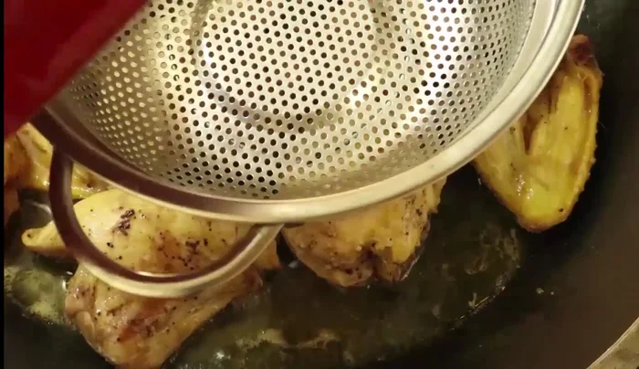Add the strained marinade to the cooked chicken.
