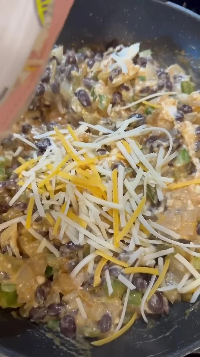 Add vegan cheese and enchilada sauce.