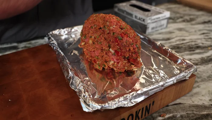 Shape the mixture into a meatloaf on a foil-lined sheet pan.