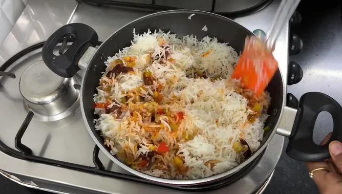 Add the cooked rice and lemon juice. Garnish with coriander.