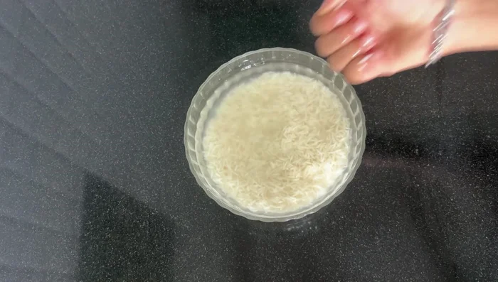 Soak basmati rice for 2-3 hours. Cook rice until 90% done, then strain immediately.