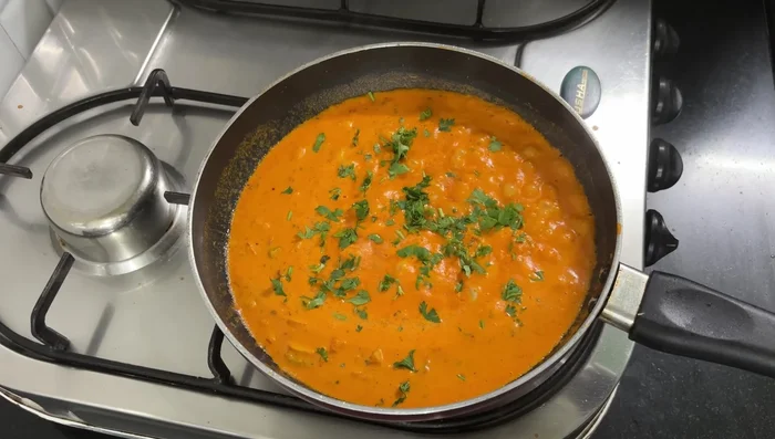 Garnish with coriander and cheese (optional). Cook for 5 minutes.
