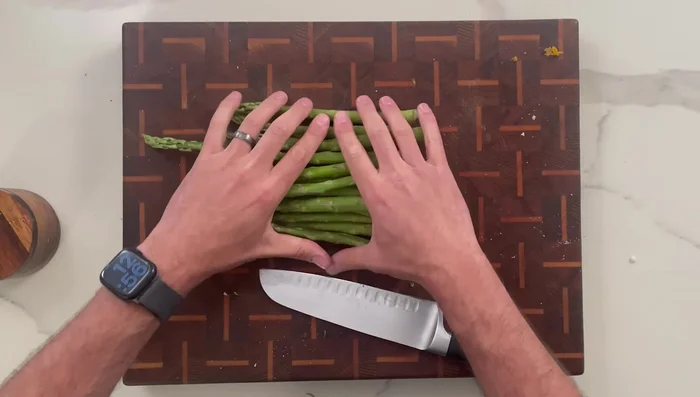 Trim asparagus and blanch in boiling water for 2-3 minutes, then immediately plunge into an ice bath.