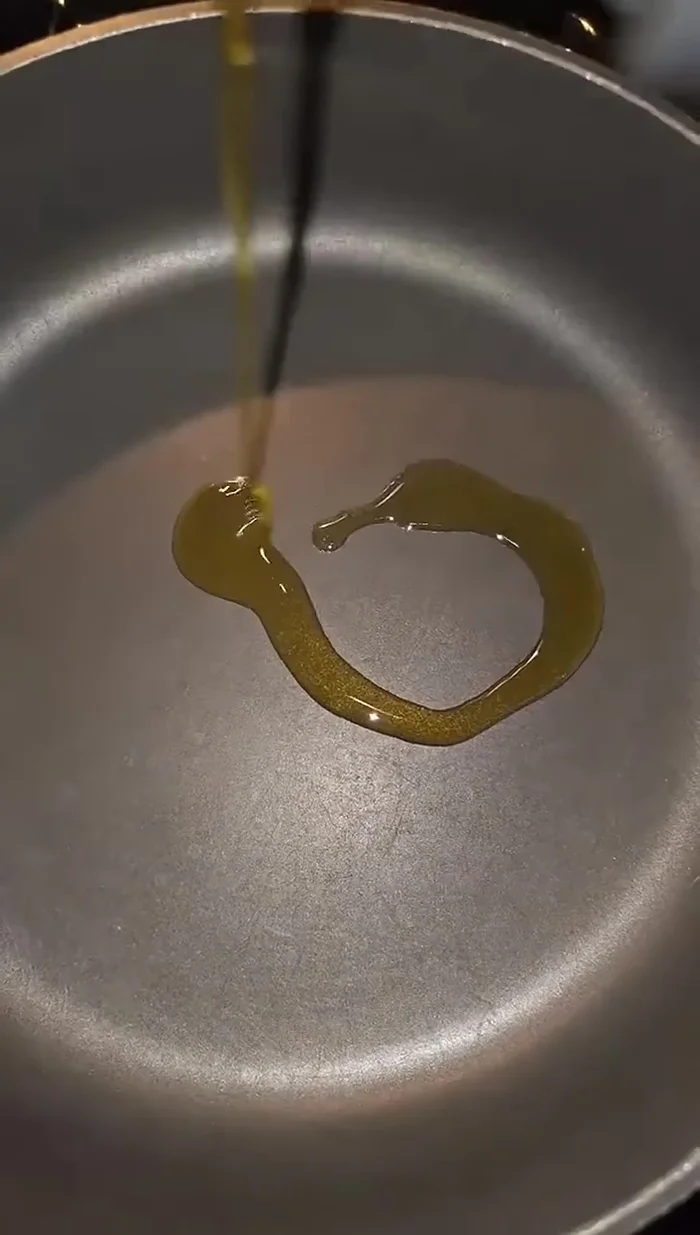 Heat oil in a pan.
