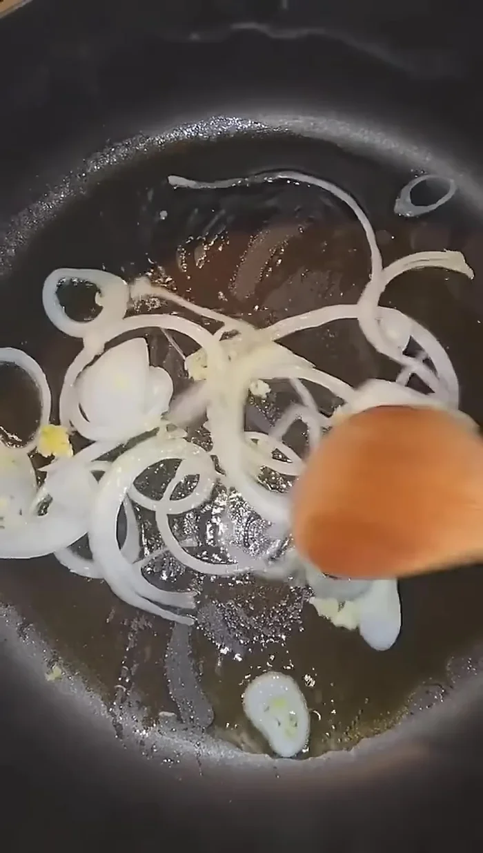 Add chopped onion and garlic to the hot oil and sauté until fragrant.