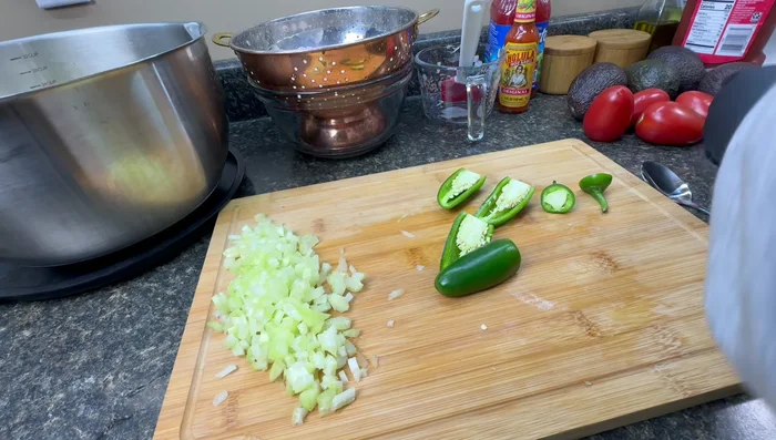 Prepare jalapenos: seed and finely chop. Add more for extra spice.