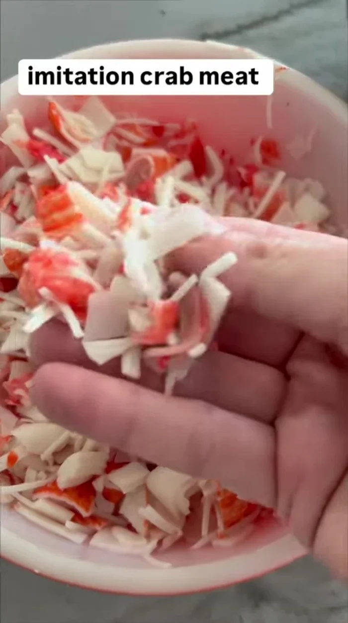 Shred and chop imitation crab meat into small bite-sized pieces. Add to the bowl.