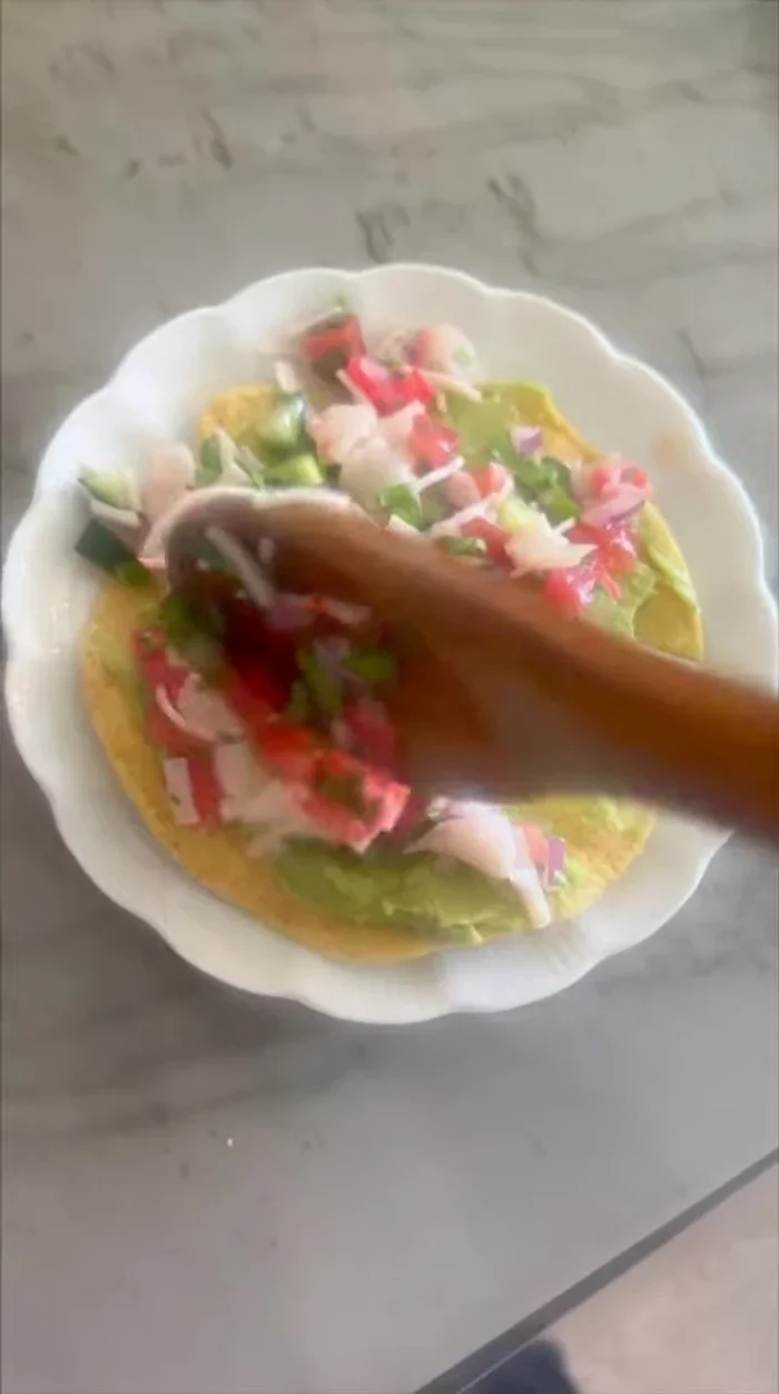 Add the ceviche on top of the avocado.