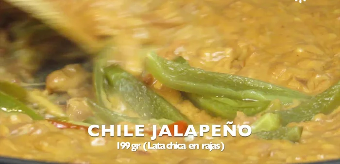 Add cubed cheese and stir until melted. Add pickled jalapeño peppers.