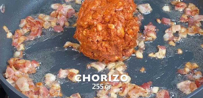 Add chorizo to the skillet with the bacon and fry until golden and well mixed.