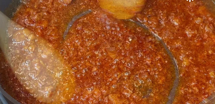 Add lard and fry until it melts completely and its flavor integrates with the other ingredients. Remember to monitor the chorizo, turning it frequently to prevent burning.
