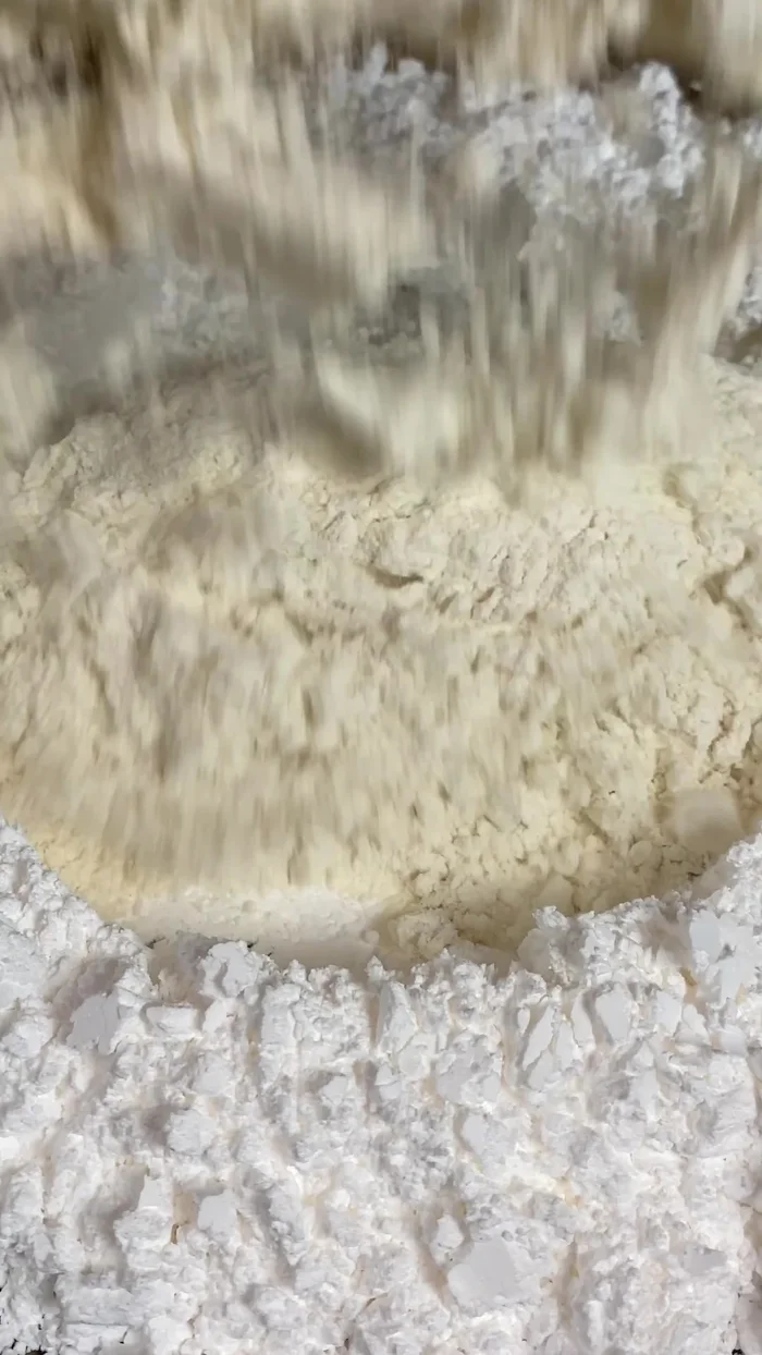 Prepare the crust: Mix sugar, flour, and vegetable shortening until the butter melts and a paste forms. Add cocoa powder for brown, food gel for pink, or leave it white.
