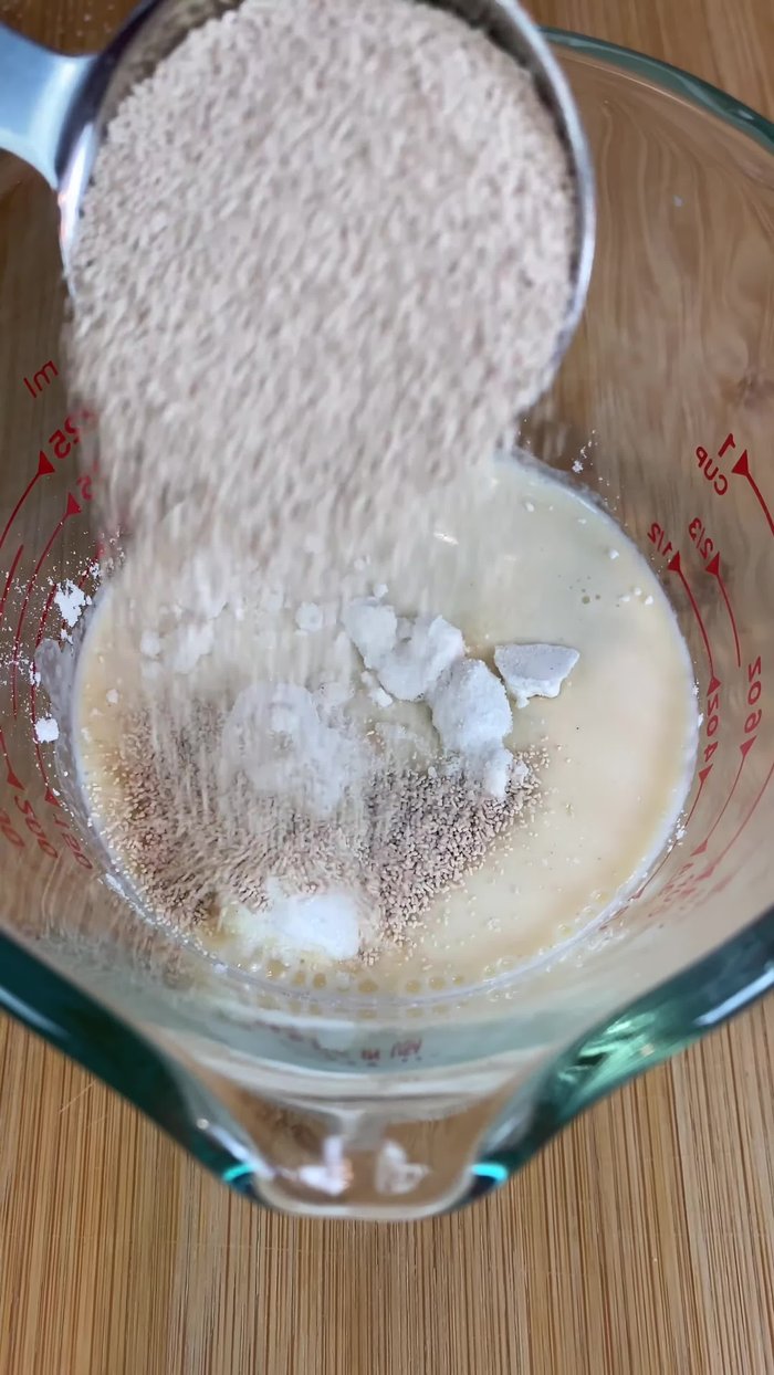 In a bowl, combine flour, sugar, and activated yeast. Mix until bubbles form. Let it rest in a warm place for 15 minutes.