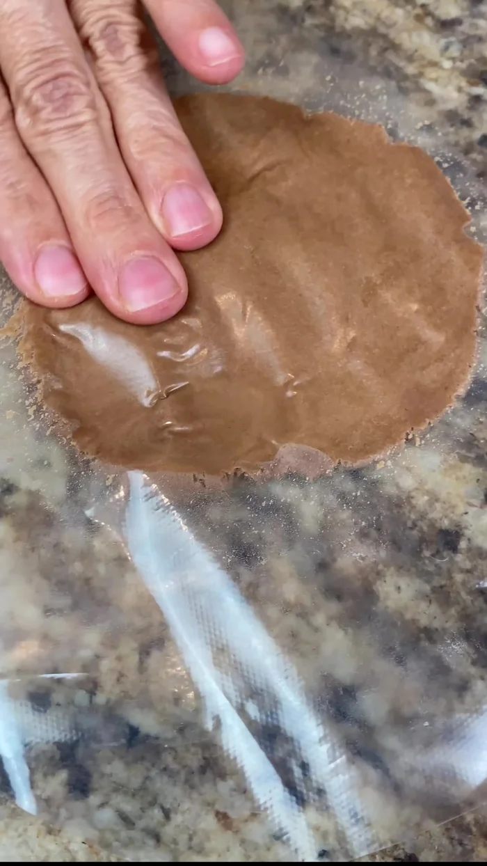 After the second rise, decorate the dough balls with the prepared crust using a cookie cutter or knife. Press the crust gently to avoid it falling off.