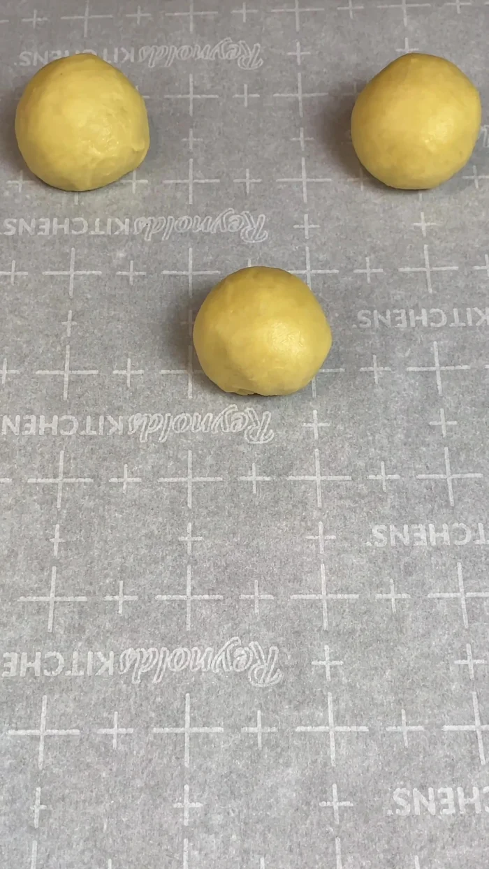 Let the dough balls rise again until doubled in size. Lightly brush with vegetable shortening and cover with plastic for 30 minutes.