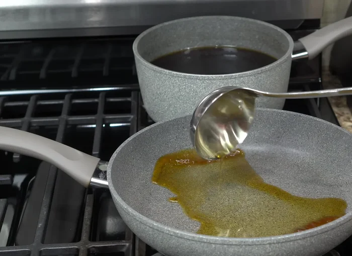 Caramelize the fritters: Reheat the caramel syrup until it thickens and bubbles. Dip each fritter into the hot syrup, turning to coat evenly. Transfer to a container to cool and set.