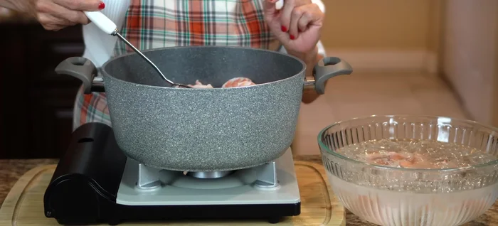 Immediately transfer cooked shrimp to an ice bath to stop the cooking process.