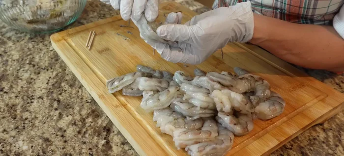 Remove the shells from the shrimp and reserve the shells.