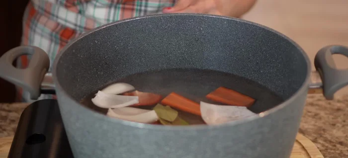 Make the shrimp broth: Boil water with Roma tomatoes, carrot, celery, onion, bay leaves, salt, and shrimp shells for 20 minutes.