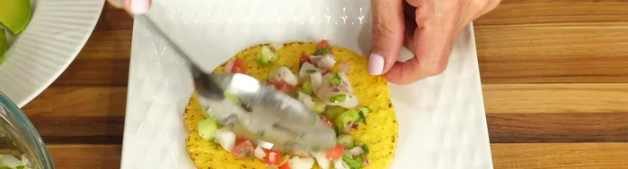 Cure the fish: Add the Mexican limes (or any type of lime) to the fish. Make sure the juice fully covers the fish. The tilapia will quickly change color as the lime 'cooks' it, (2:59). Let it sit for 15-30 minutes (3:31), checking frequently to ensure it doesn't over-cure.