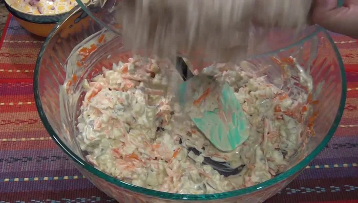 Add the shredded chicken to the mixture.