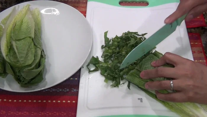 Slice the cooked corn.