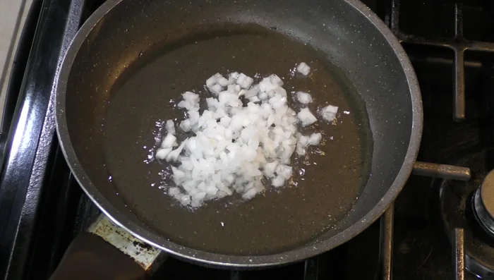 Prepare the beans: In a pan, sauté the chopped onion and garlic in oil until softened. Add the cooked beans and mash slightly. Simmer for 12 minutes, until the beans have thickened.