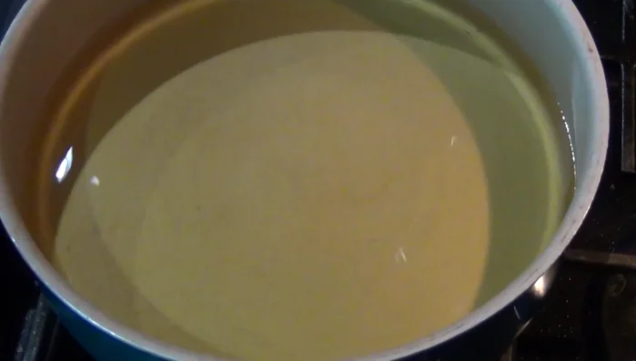 Brown the tortillas in hot oil until golden brown.