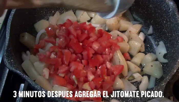Add the chopped tomatoes to the pot.