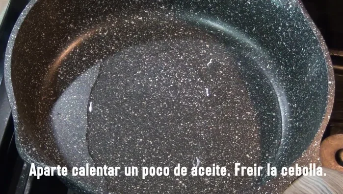 Heat oil in a frying pan. Sauté the onion for 6 minutes.