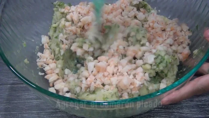 Stir in the chopped shrimp and cheese.