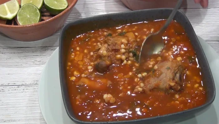 Serve hot, garnished with lemon, fresh cheese, and optionally, cream.