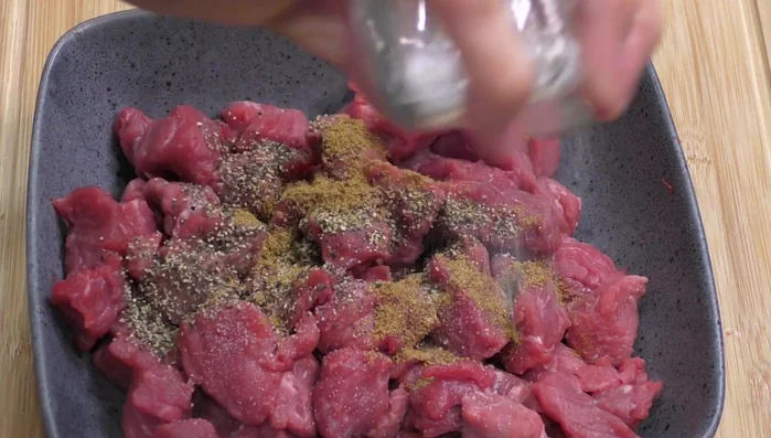 Season the meat: Add cumin, pepper, and salt to the meat. Mix well.