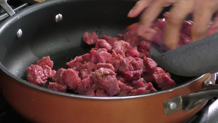 Sear the meat: Heat oil in a pot and brown the meat for 15 minutes.