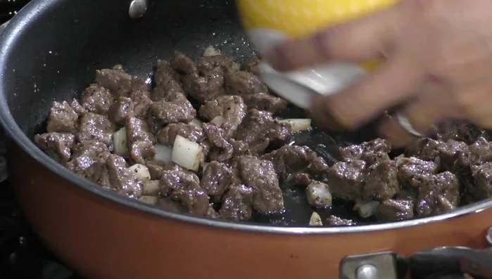 Add onion and carrot: Once the onion is transparent, add the carrot.