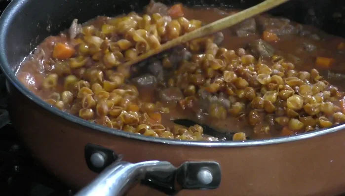 Add pasta, water/broth, and salt: Add pasta, 3 cups of water or chicken broth, and salt.