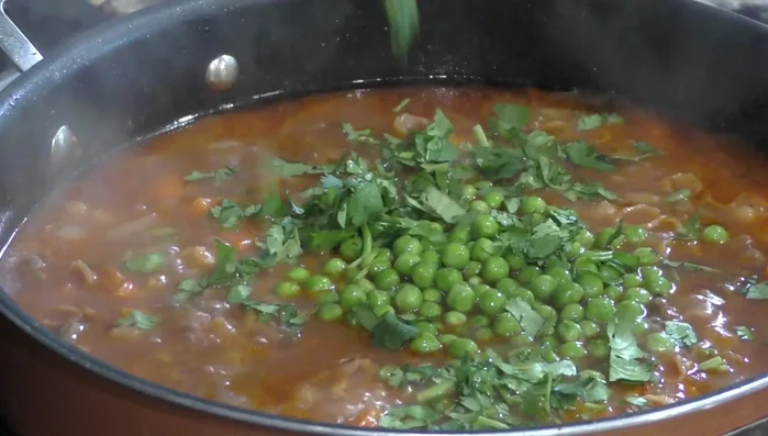 Add peas: Add peas and continue cooking for 8 minutes.