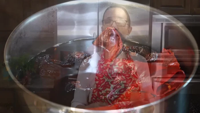 Turn off heat, let chiles hydrate and enlarge. While this happens, remove cooked chicken from broth, remove skin, and shred.