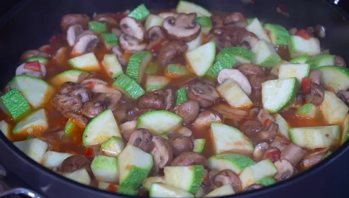 Add the epazote and poblano pepper strips, stir, and cover for another 5 minutes.